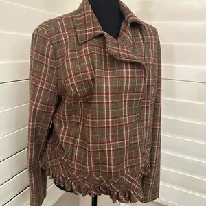 Cute fall jacket with ruffle detail and side zipper.